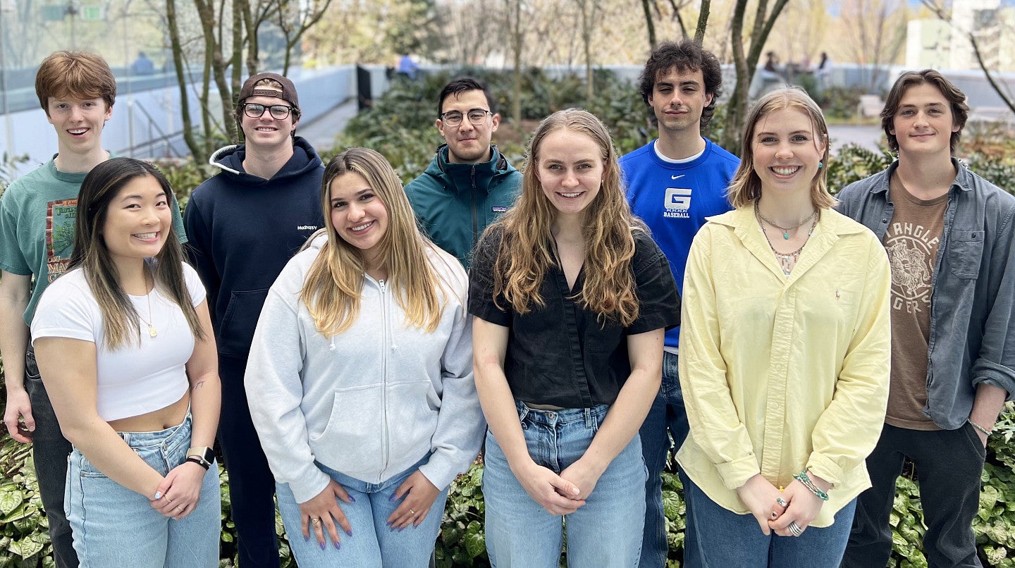 A group of students standing on a terrace