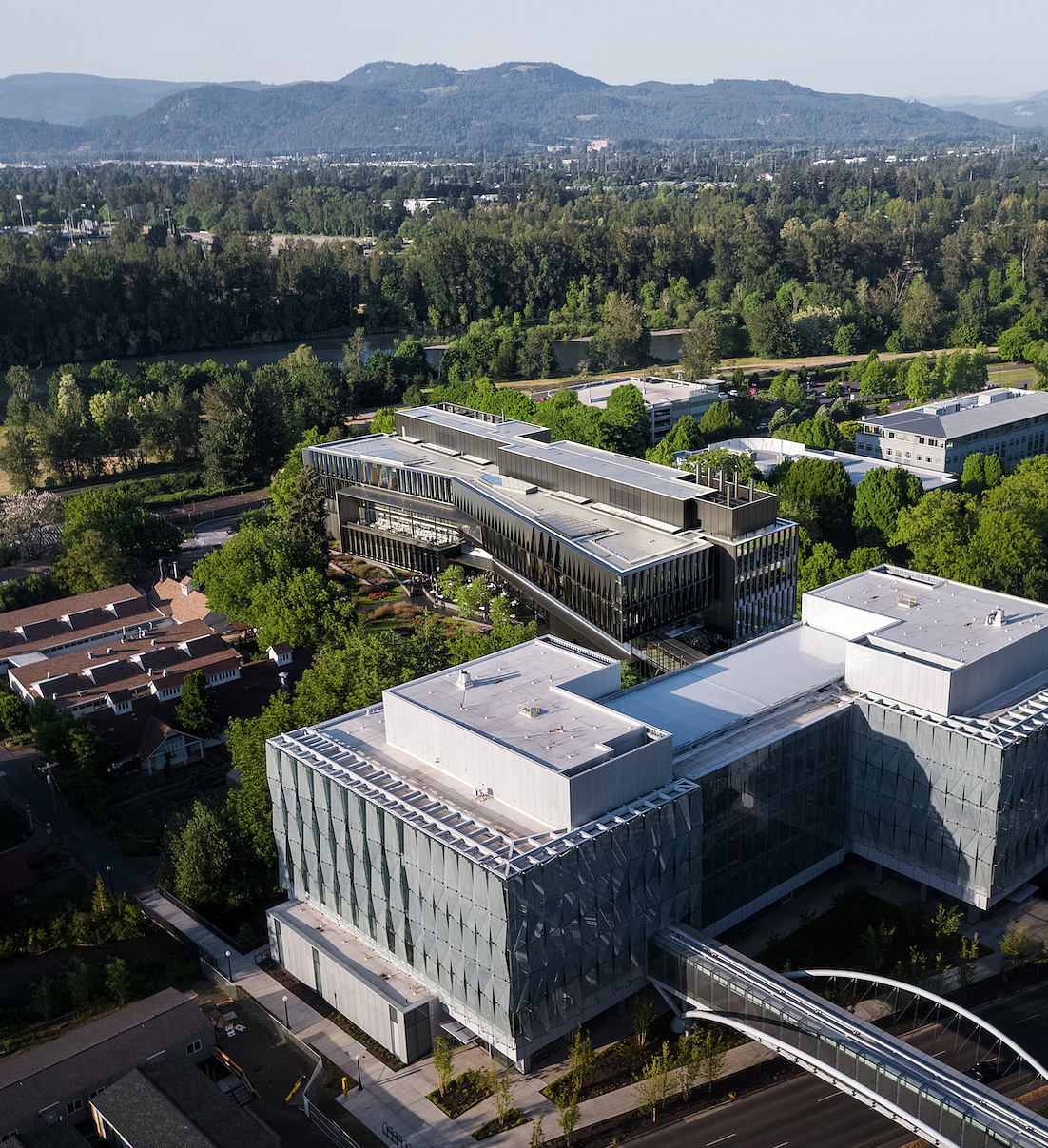 An aerial perspective rendering of two modern buildings