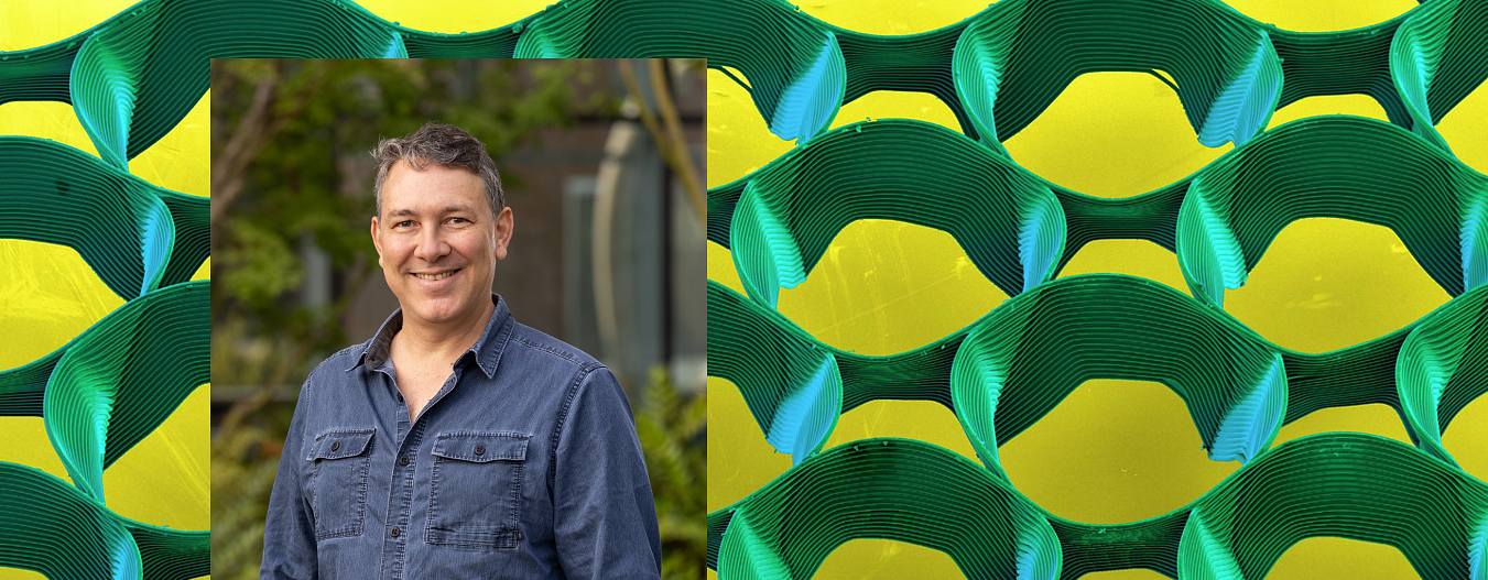 Collage of man with blue shirt against background of 3-d printed material