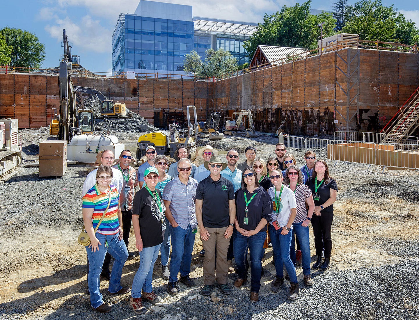 A group of people standing in front of a construction site