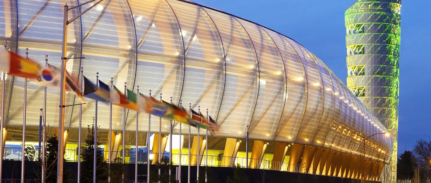 Hayward field at twilight with flags