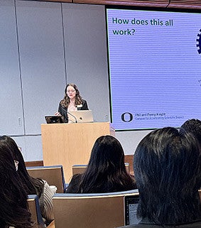 A woman speaking at a podium