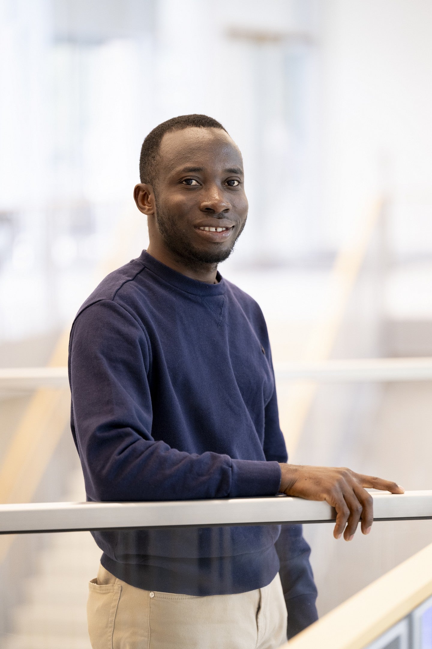 David Dzamesi standing inside the Knight Campus building