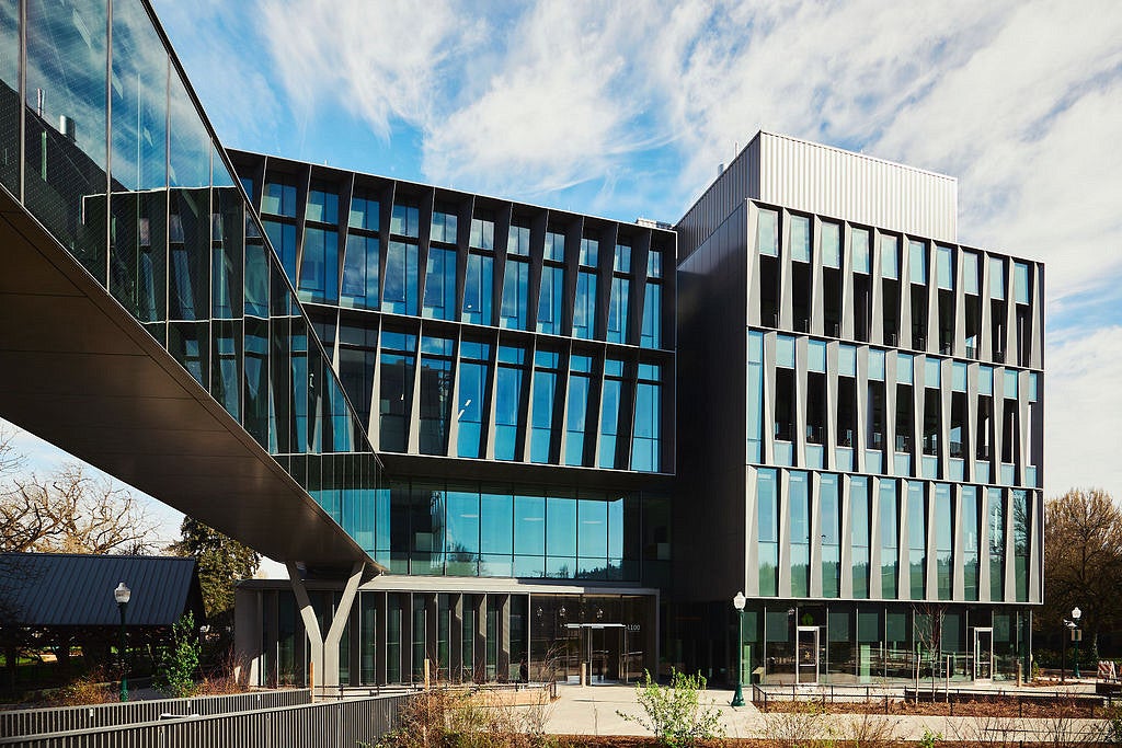 glass and steel exterior of building 2, with blue skies 