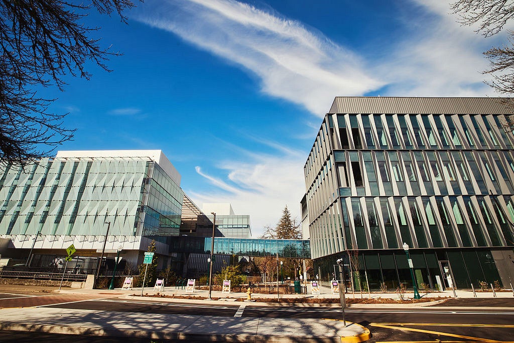 view of building 1 and building 2 connected through a skybridge, with blue skies