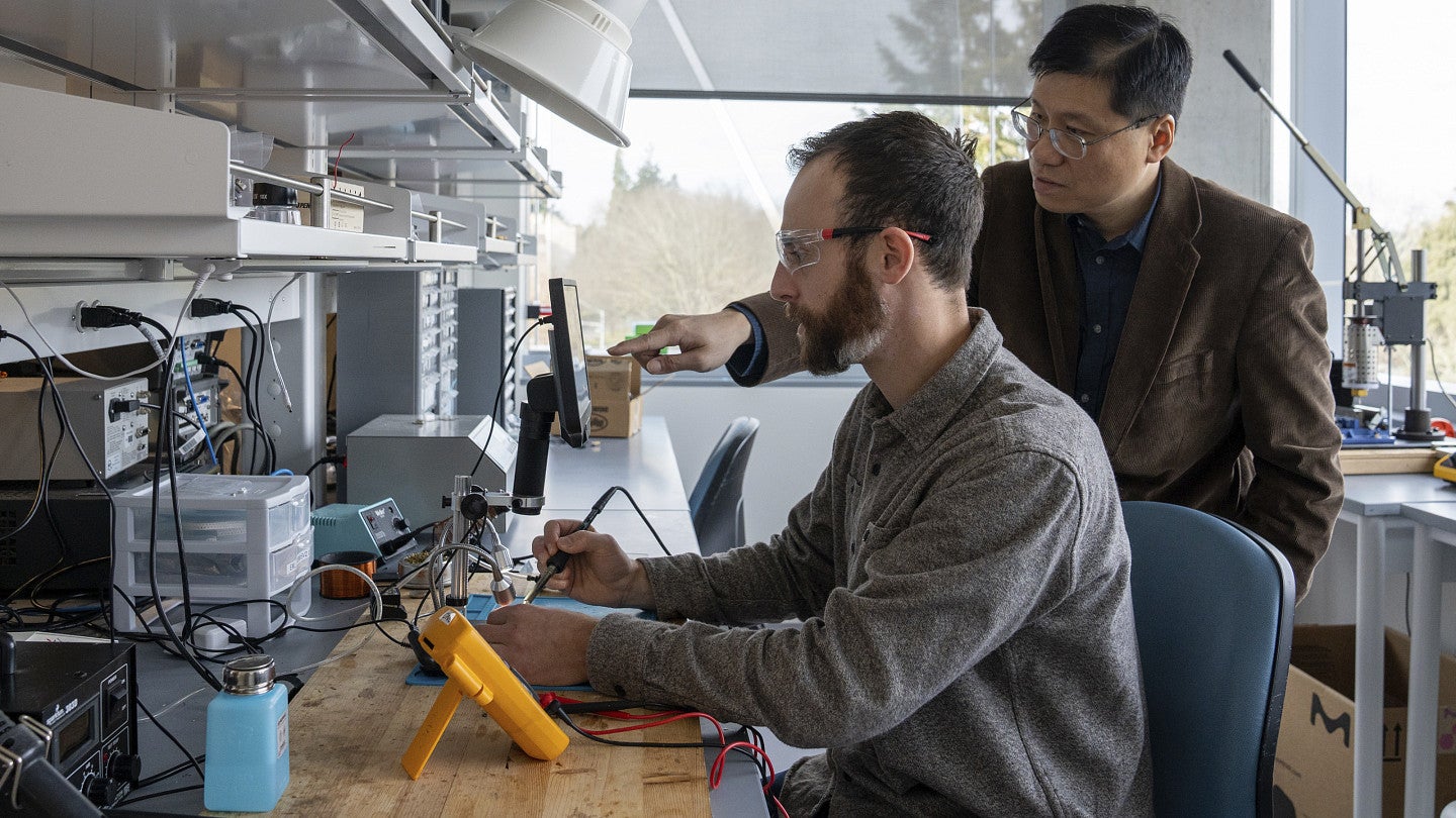 Researchers in Knight Campus lab