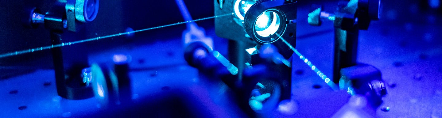 Image of lasers and nonlinear optics with blue and purple tint
