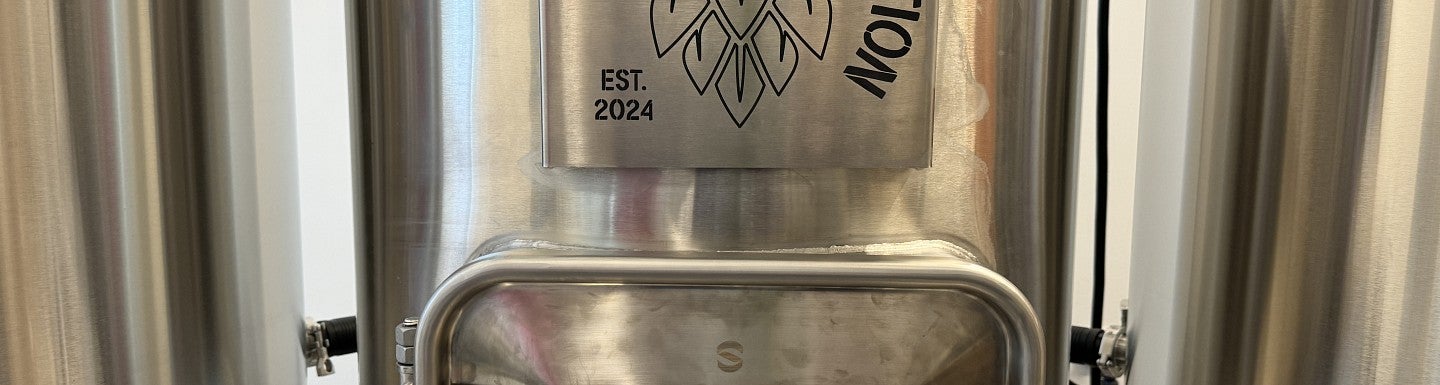 Image of tank with lettering reading "Brewing Innovation" and image of hop cone