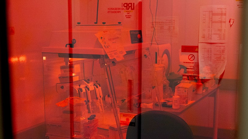 a lab room, with science equipment, viewed through a red glass filter