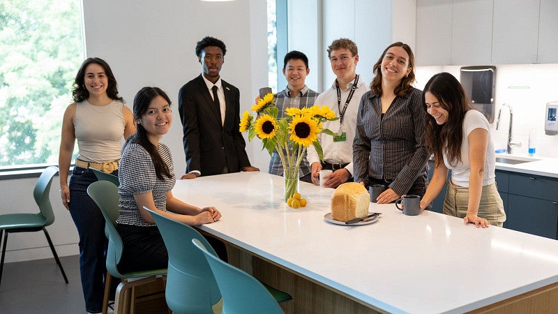 students standing around a table together