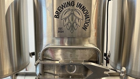 Fermentation Tanks with Brewing Innovation logo on the front