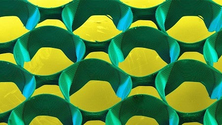 abstract cicular shapes (green), with a yellow background - printed using Melt electowiring. 