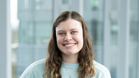 Headshot of Cora Ferguson in the lobby of the Knight Campus