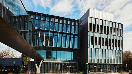 glass and steel exterior of building 2, with blue skies 