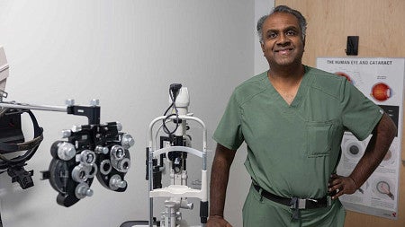 Man in scrubs smiling
