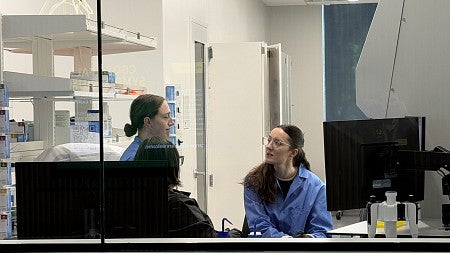 People in lab discussing work