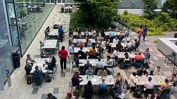Students gather for lunch on the Knight Campus outdoor terrace
