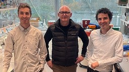 Three people in a lab with street clothes