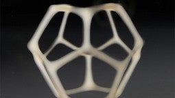 a dodecahedron, printed with VAM. It is empty on the inside, and a tan-beige color