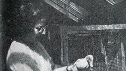 black and white image of a woman, Hildegard Lamfrom, holding a duck in her hands