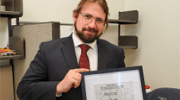 Clyde Overby with PhD thesis from the Benoit Lab