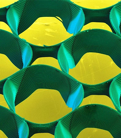 abstract cicular shapes (green), with a yellow background - printed using Melt electowiring. 