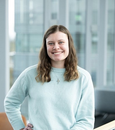 Headshot of Cora Ferguson in the lobby of the Knight Campus
