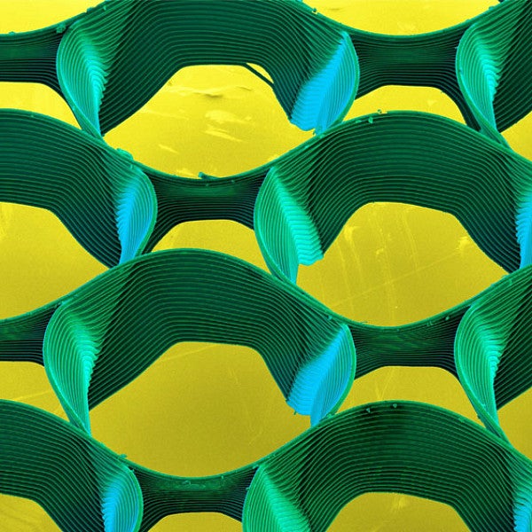 abstract cicular shapes (green), with a yellow background - printed using Melt electowiring. 